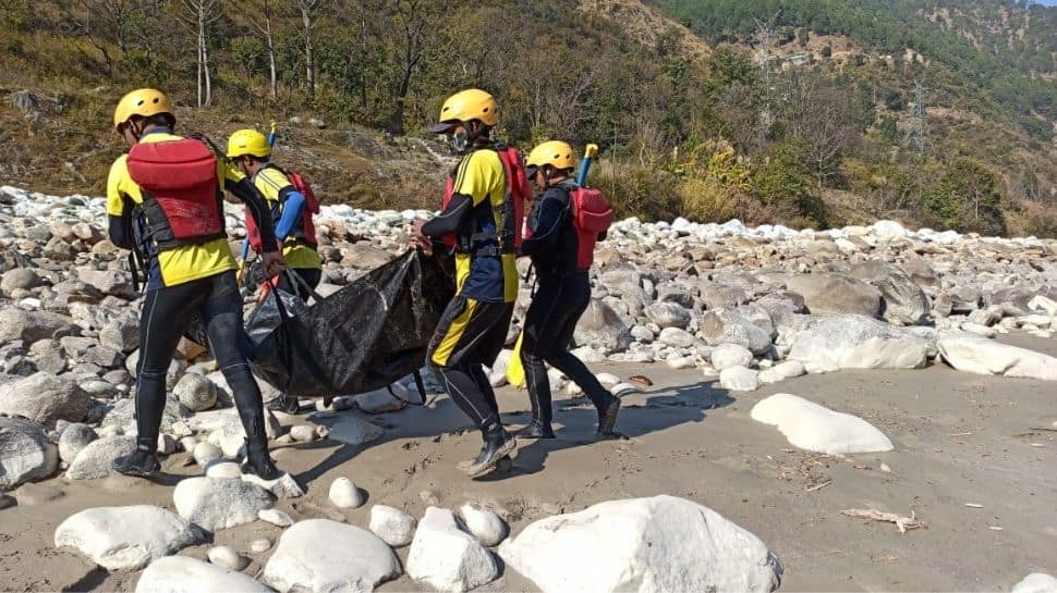 SDRF perssonel rowing around in river to look for survivors