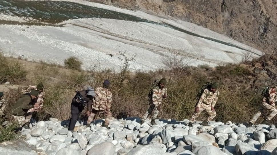 Rescue team searching river banks