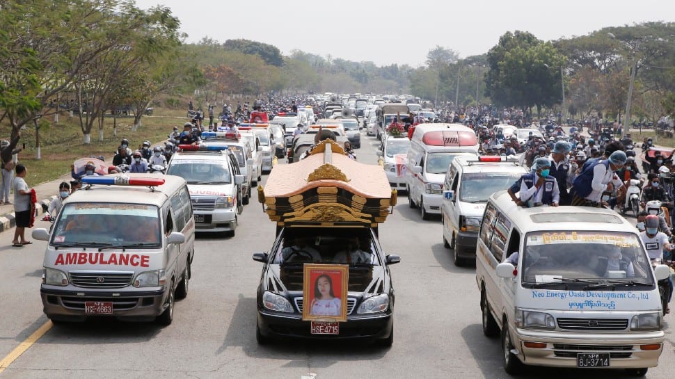 A Hearst containing casket of Mya Thwet Thwet Khine travels to the cemetery in Myanmar