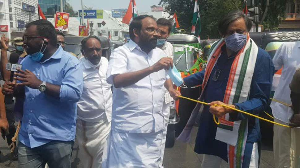 Kerala Congress MP Shashi Tharoor pulls auto-rickshaw in protest against fuel price hike - WATCH