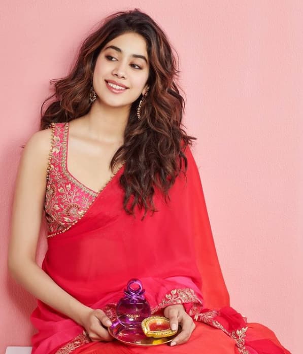 Janhvi is festive ready in a red and pink saree