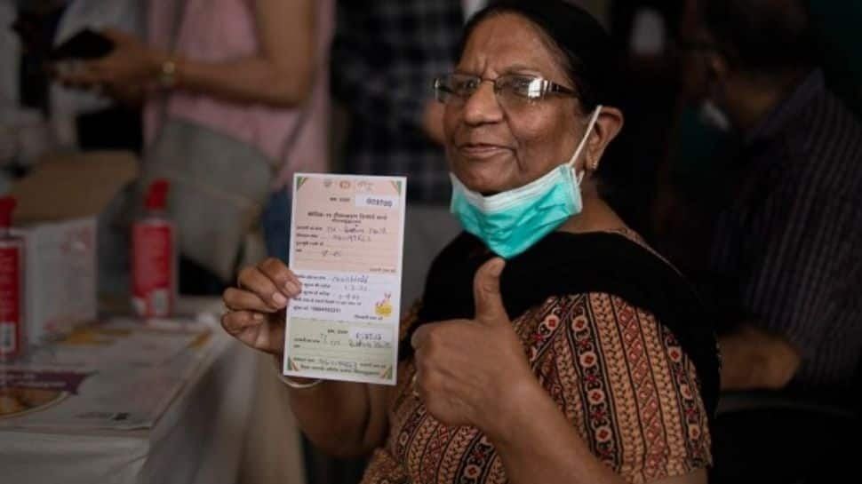 Beneficiary psoing after receiving covishield vaccine shot