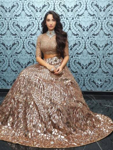 Nora is a show-stealer in this gold lehenga set