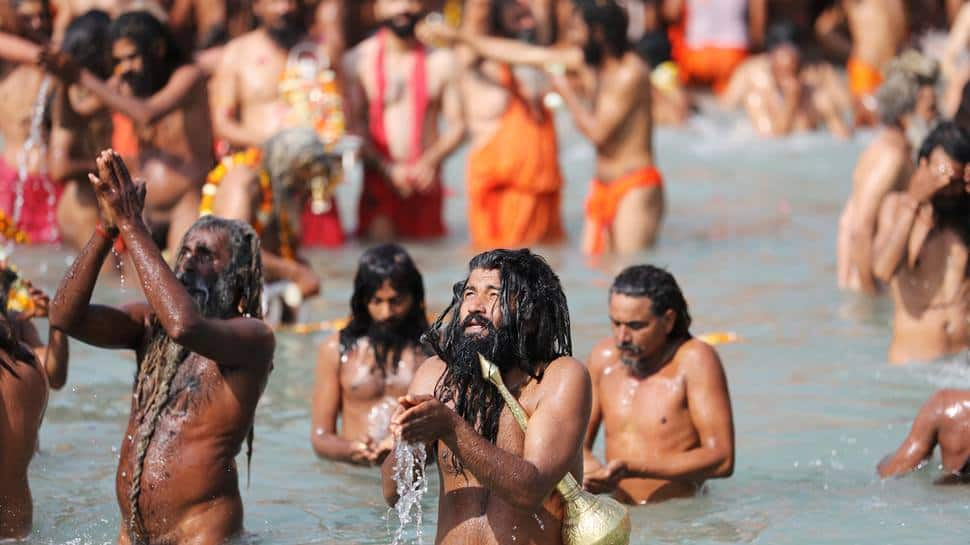 Naga Sadhus take holy dip in Ganga on Maha Shivratri