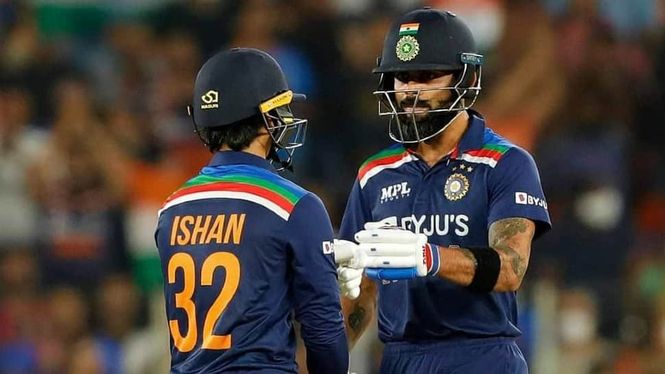 Skipper Virat Kohli interacts with Ishan Kishan during the second T20 against England at Narendra Modi Stadium in Ahmedabad. (Source: Twitter)