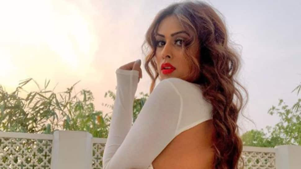 Nia Sharma flaunts her toned body in a backless white crop top and