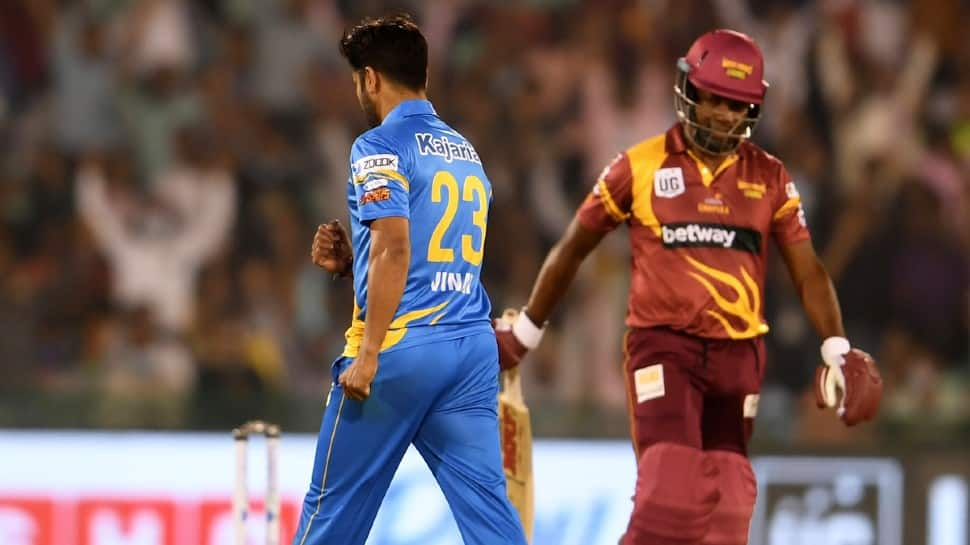 West Indies Legends captain Brian Lara (left) walks back after being dismissed by India Legends' Vinay Kumar in their Road Safety World Series semis clash. (Source: Twitter)