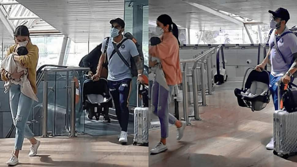 Virat Kohli clicked performing &#039;daddy duties&#039; at airport, Team India reach Pune for ODIs