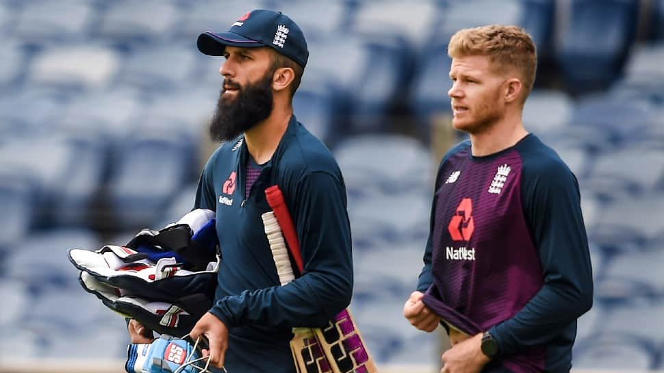 England all-rounder Moeen Ali (left) and Sam Billings arrive for a training session in Pune. (Photo: PTI)