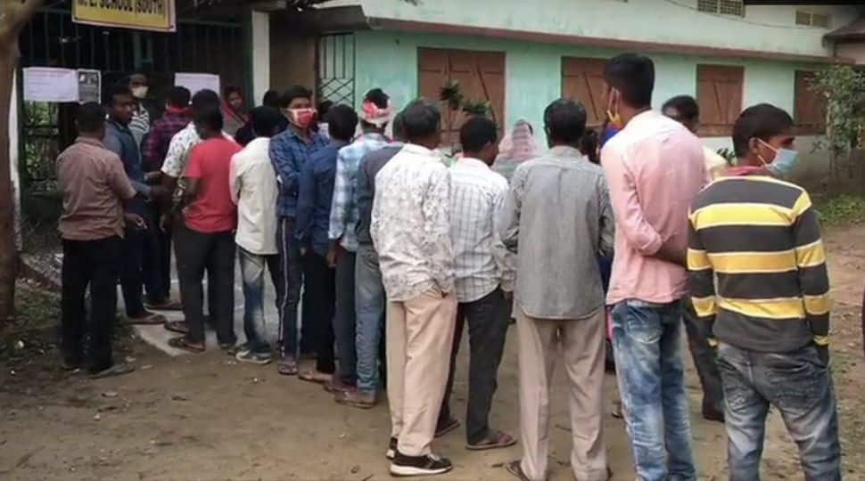 A long queue of voters outside a polling station in Bakul, Dibrugarh can be seen. 