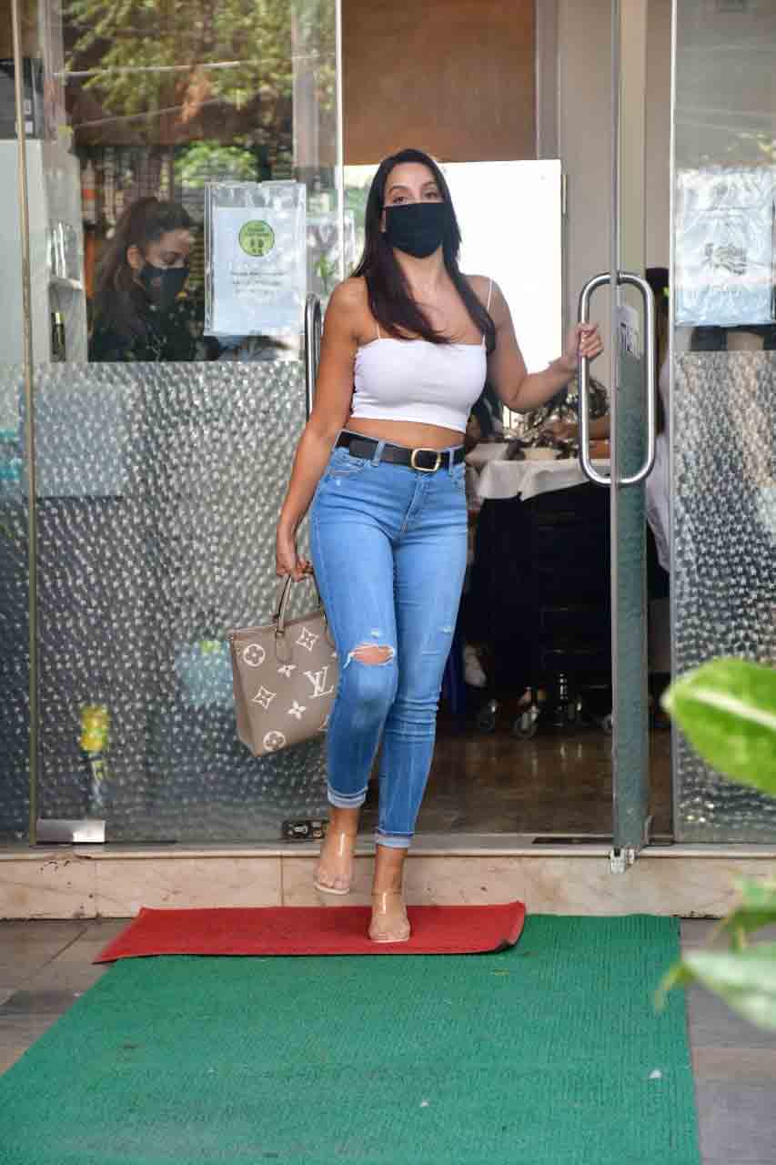 Nora Fatehi steps out in strappy cropped top, ripped jeans after