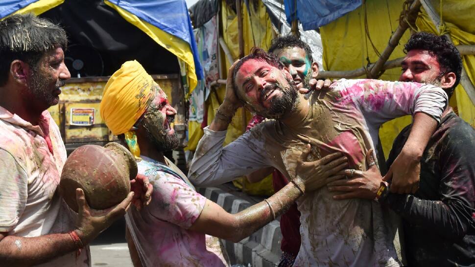 Farmers at Delhi borders used clay to celebrate a happy Holi