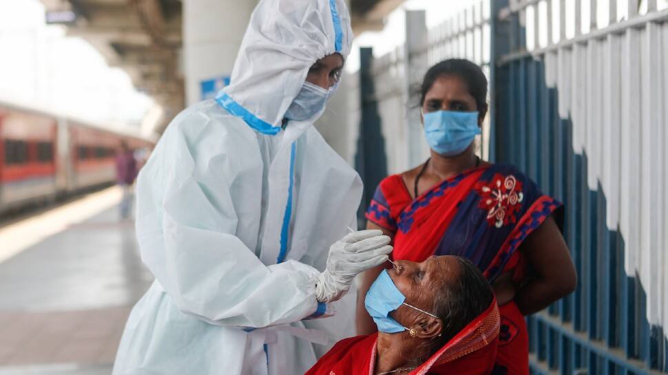 A train passenger gets tested for COVID-19 in Mumbai