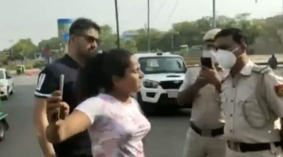 Drama on Delhi streets: Couple misbehaves with cops when asked about not wearing masks -- WATCH