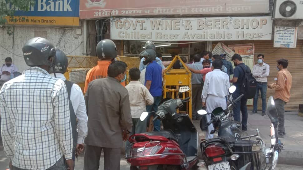 Residents of CP in Delhi gather outside liquor store