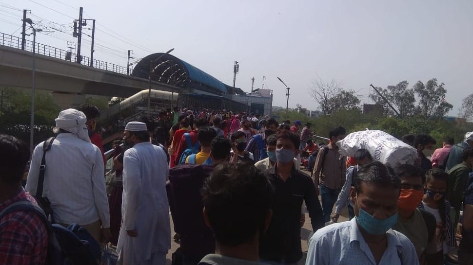 Migrant labourers rush to metro stations to leave Delhi city