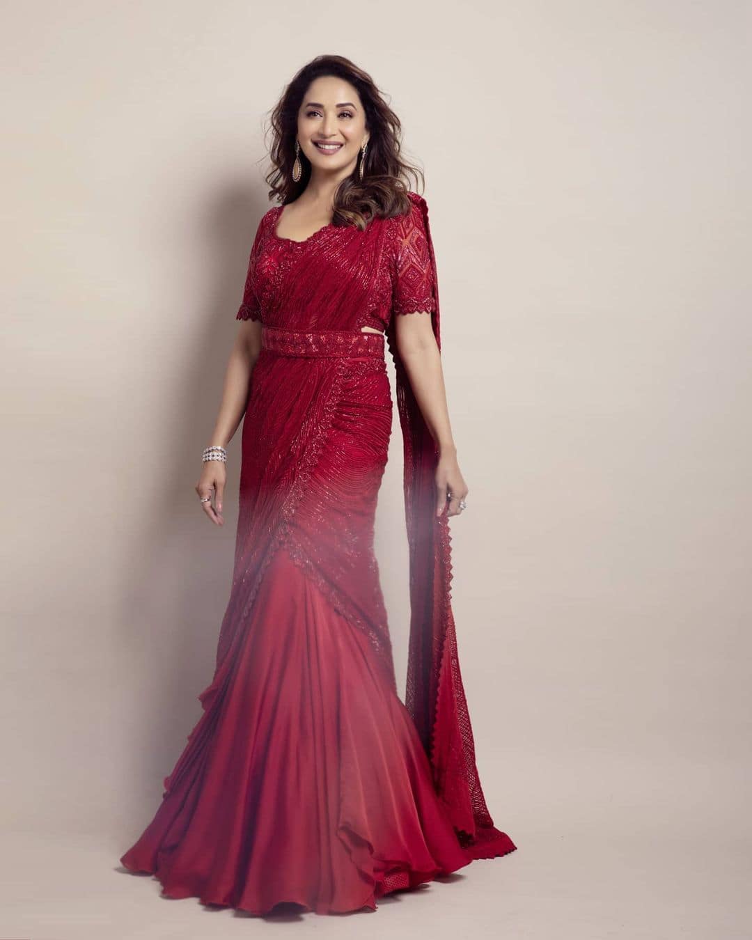 Madhuri looks ravishing in a red saree