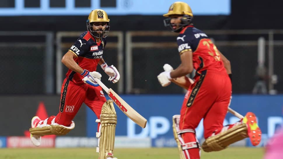 Royal Challengers Bangalore skipper Virat Kohli runs between the wickets with Devdutt Padikkal against Rajasthan Royals in Mumbai. (Photo: ANI)