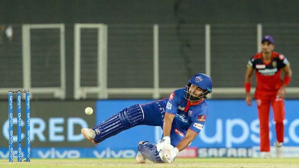 Delhi Capitals skipper Rishabh Pant takes a tumble while going for a flick against Royal Challengers Bangalore in their IPL 2021 clash. (Photo: PTI)