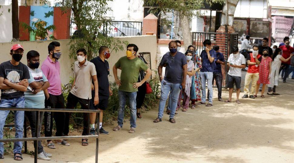 People queue up to receive the dose of the Covid-19 vaccine at a vaccination centre in Ahmedabad, Gujarat.