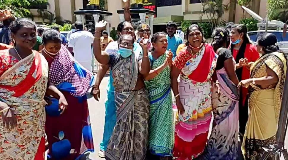 DMK supporters celebrate their party's victory in the Tamil Nadu assembly election, in Chennai on Sunday. 