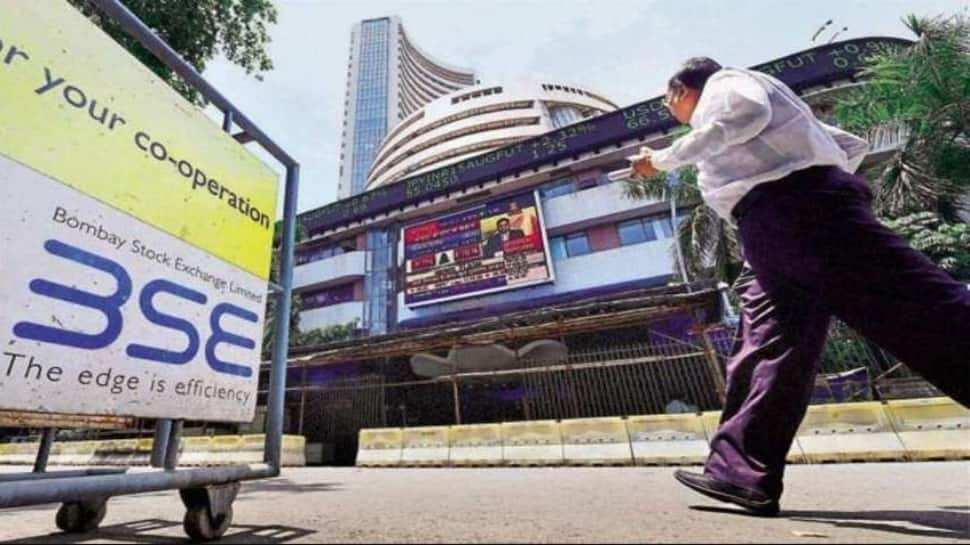 Sensex sees 690 pts recovery, ends 64 pts down; Nifty inches up to 14,634 led by metals and FMCG