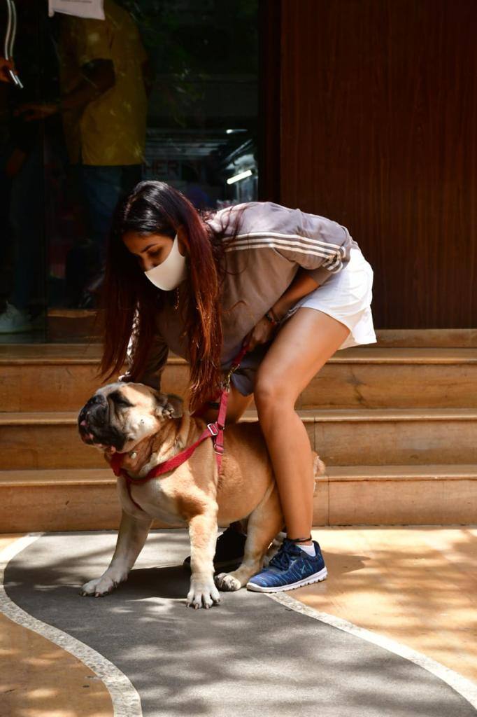 Sonnalli Seygall wears white shorts and brown sweatshirt for her outing