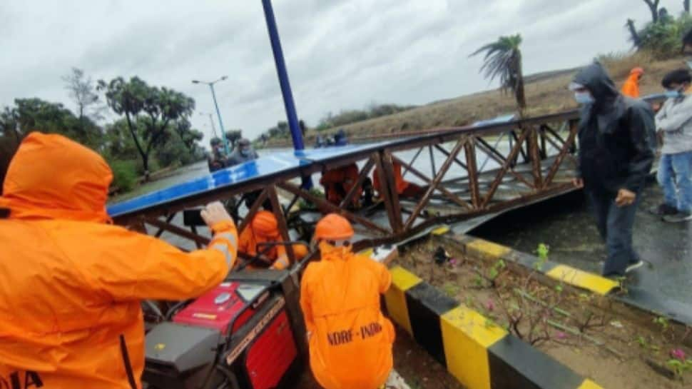 NDRF personnel carry out restoration work