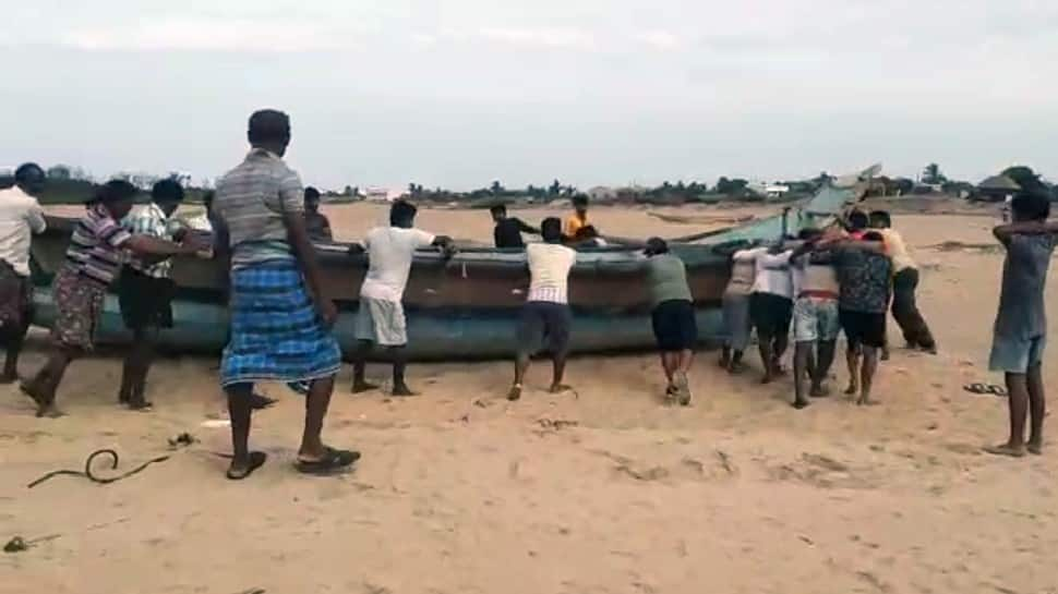 Fishermen anchored the boat on the seashore ahead of cyclone Yaas