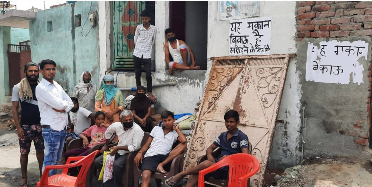 Resident of Adarsh Nagar Colony sitting outside their houses