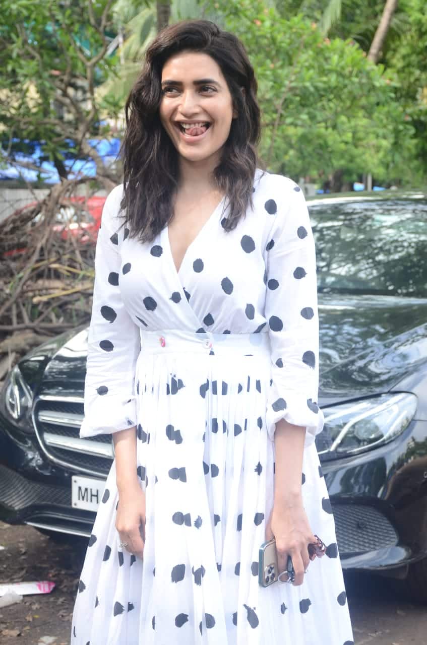 Actress dons a white polka dot dress