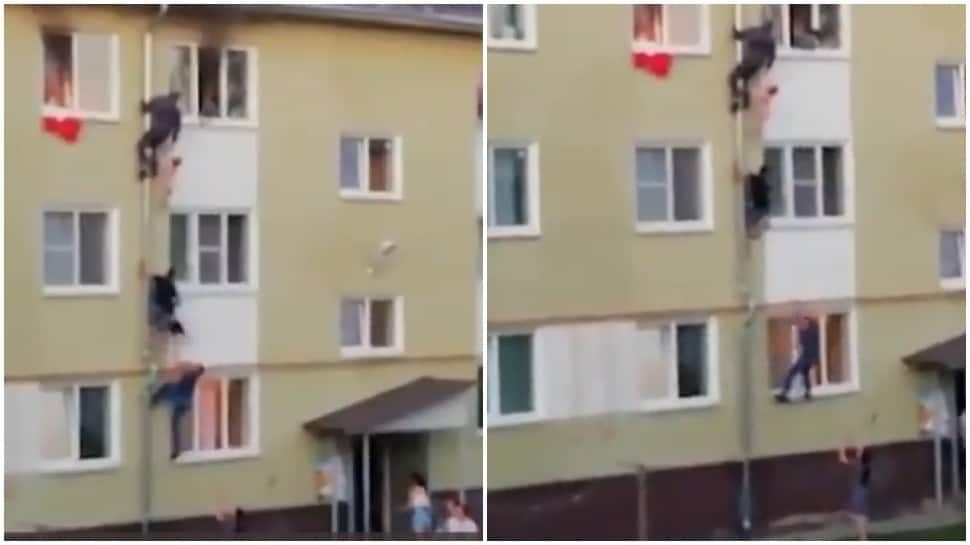 Real-life heroes: Men form human chain to save children trapped in burning building