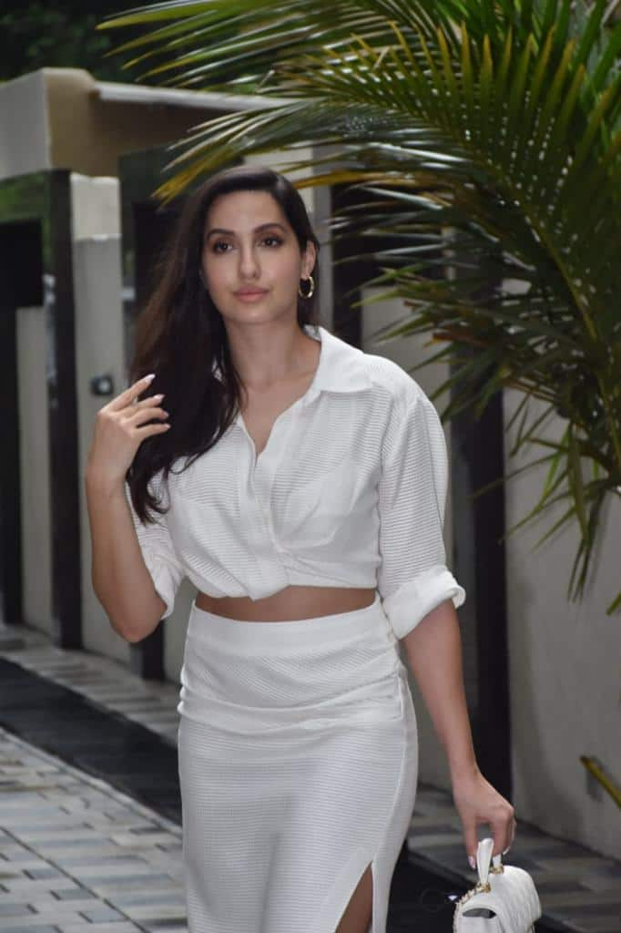 Nora Fatehi in white bralette and bodycon skirt adds sensuous charm to  airport look - India Today