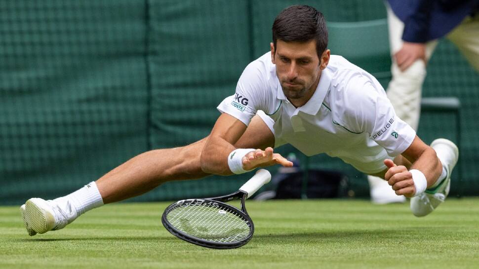 World No. 1 Novak Djokovic slides in to make a return to South Africa's Kevin Anderson in their Wimbledon round two match. (Source: Twitter)