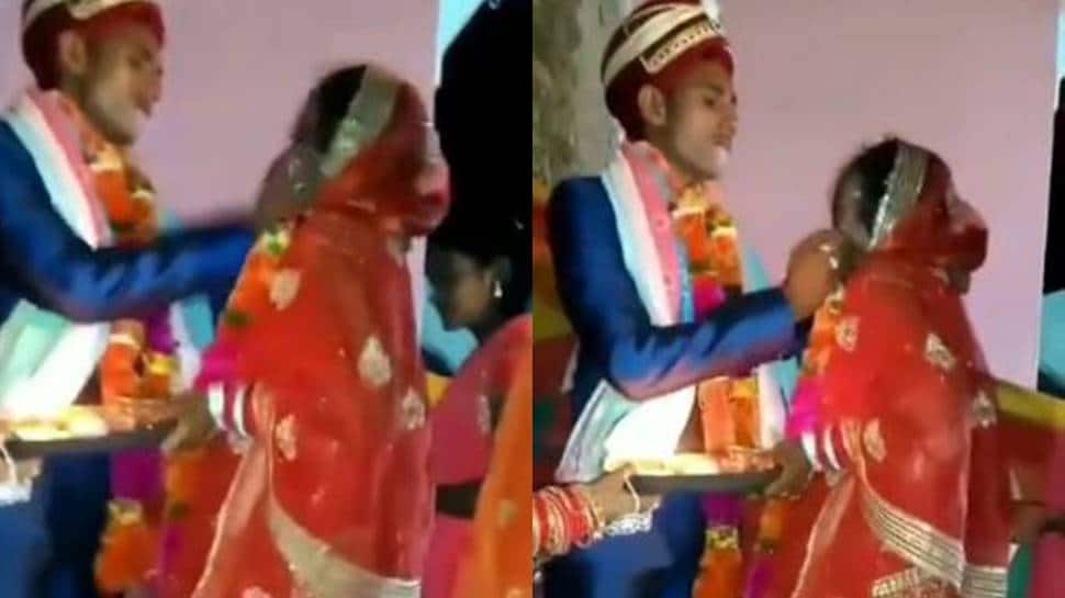 Viral video: Dulha force feeds &#039;ladoo&#039; to bride, appalled netizens call it &#039;abuse’