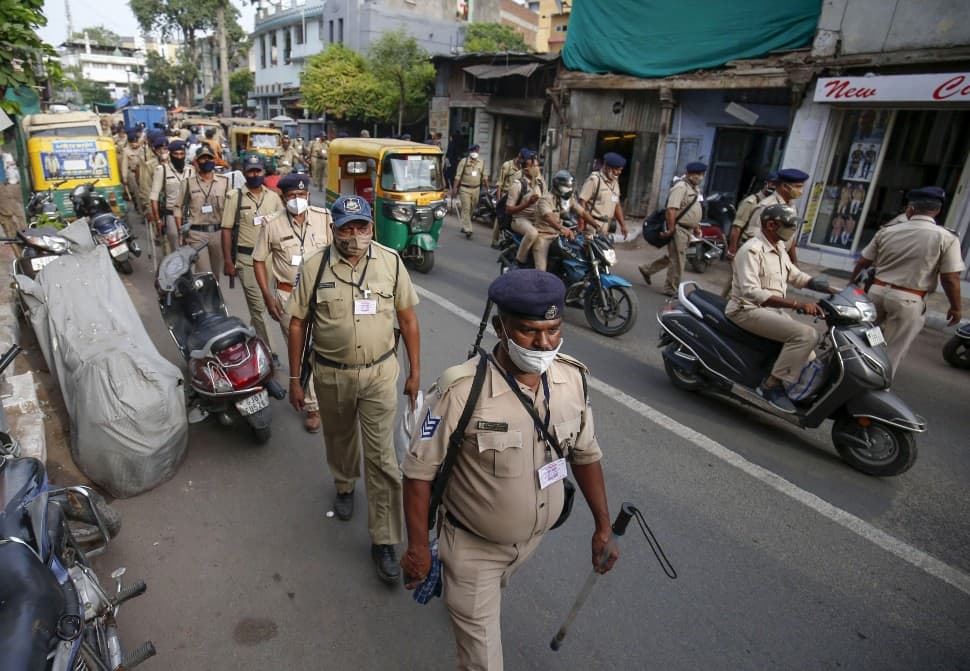 Police personnel patrol on the route ahead of annual Rath Yatra