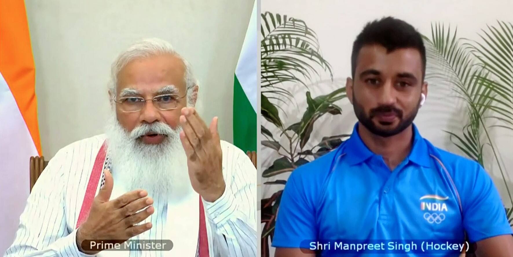 PM Modi while talking to Indian hockey captain Manpreet Singh