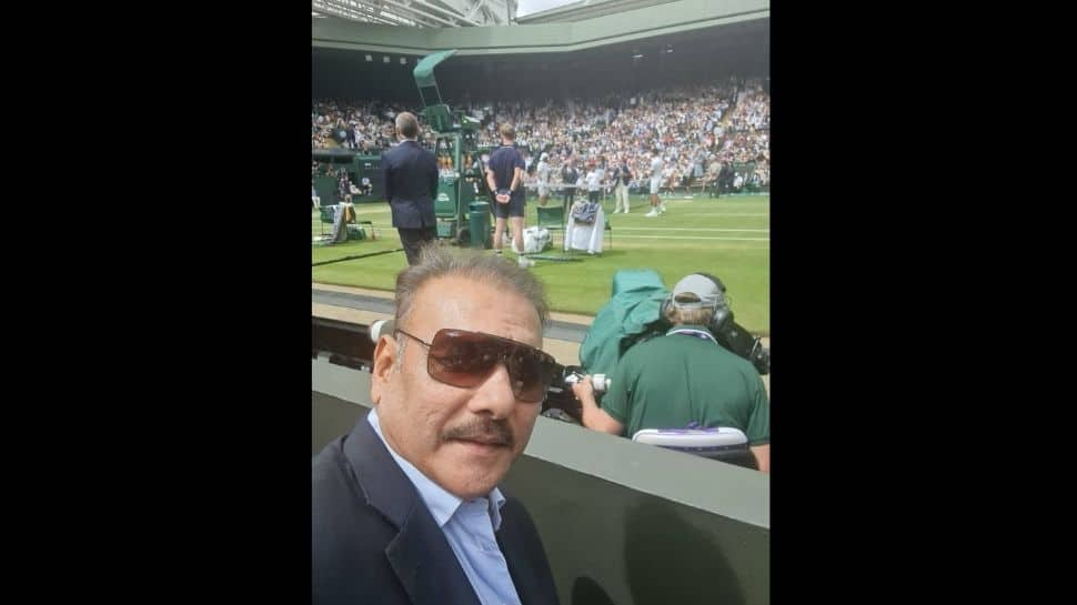 Team India coach Ravi Shastri takes a selfie at Wimbledon centre court during the men's singles final between Novak Djokovic and Matteo Berrettini. (Source: Twitter)