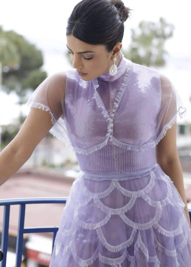 The actress glows in a pretty, lavender dress
