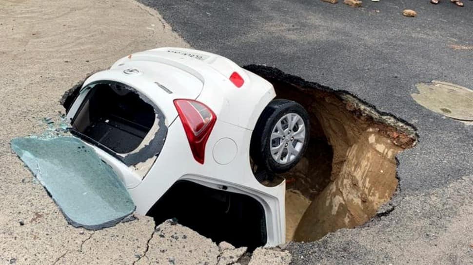 Car submerges in sinkhole as portion of road caves in after rains in Delhi