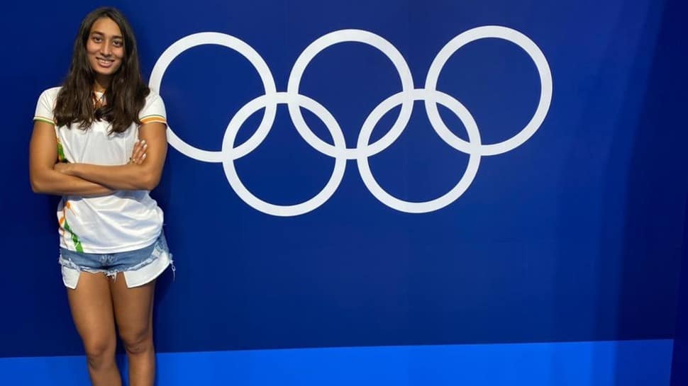 Swimmer Maana Patel poses at the Olympic Aquatics Centre in the Tokyo Bay Area. (Source: Twitter)