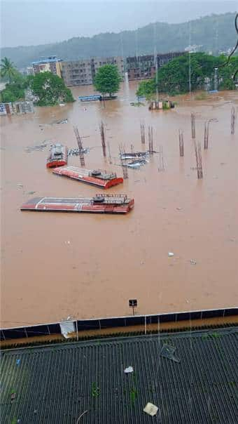 Flooded area of in Chiplun town as downpour continues in the entire coastal belt of Maharashtra. State transport buses submerged underwater amid heavy rains. 