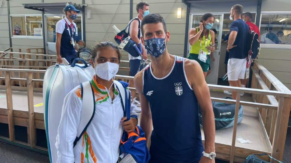 Indian tennis star Ankita Raina with world No. 1 Novak Djokovic after practice in the Tokyo tennis courts. (Source: Twitter)