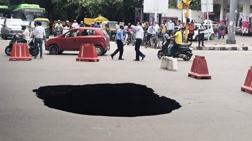 Monsoon disaster: Massive chunk of road near Delhi&#039;s busy IIT flyover caves in due to heavy rains