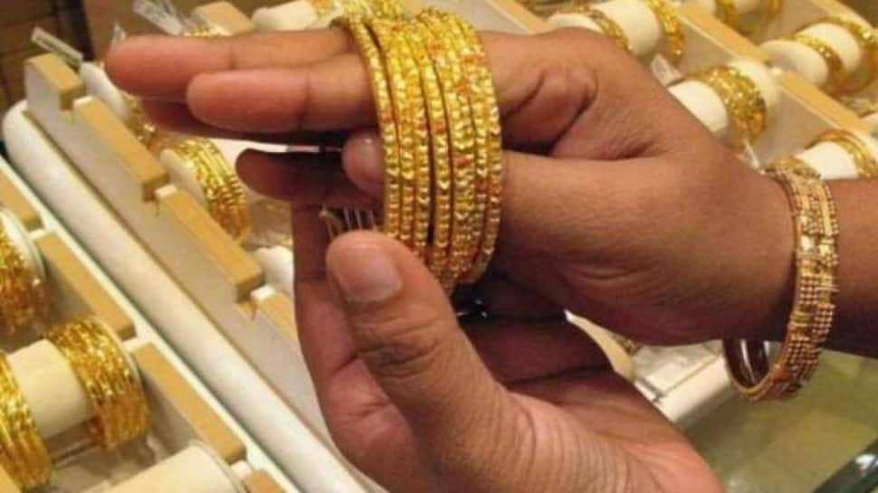 Gold tumbles to reach Rs 46,917; silver marginally lower