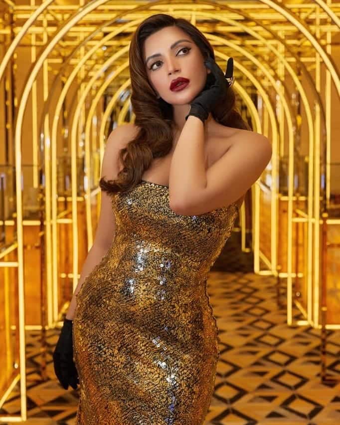 Shama stuns in a gold dress