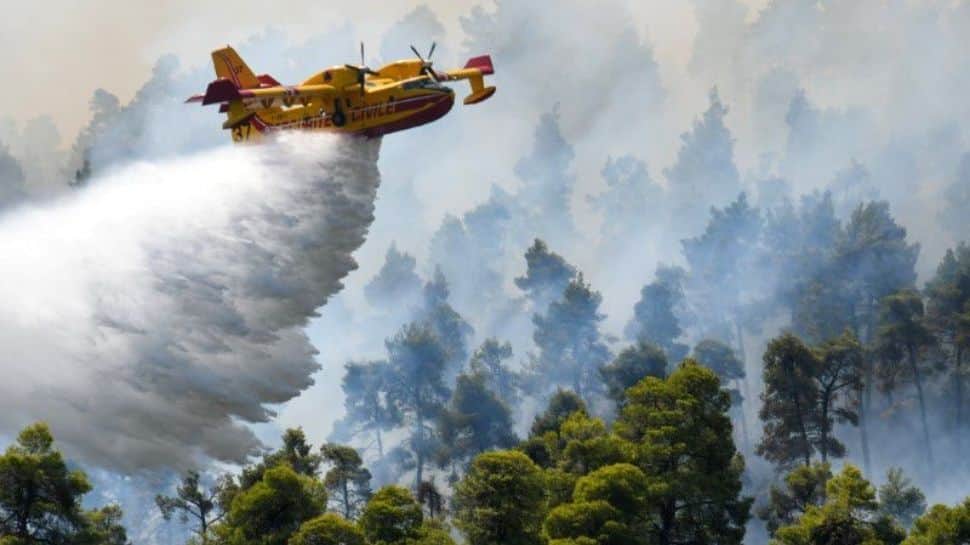 Firefighting airplane makes a water drop