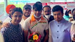 Gold medallist Neeraj Chopra returns India, gets grand welcome - WATCH