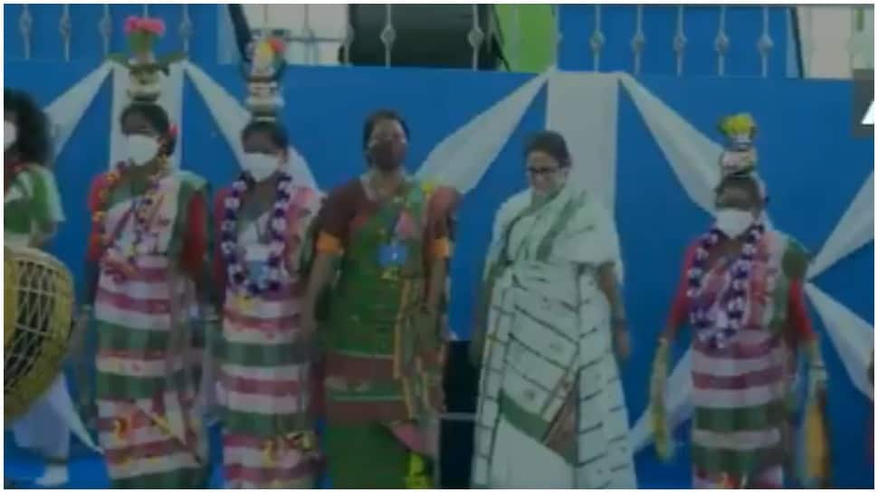 Watch: Mamata Banerjee dances, plays drum at World Tribal Day event