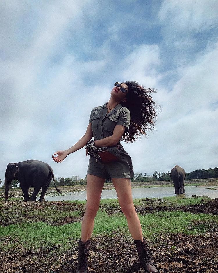 Jaqueline poses with elephants